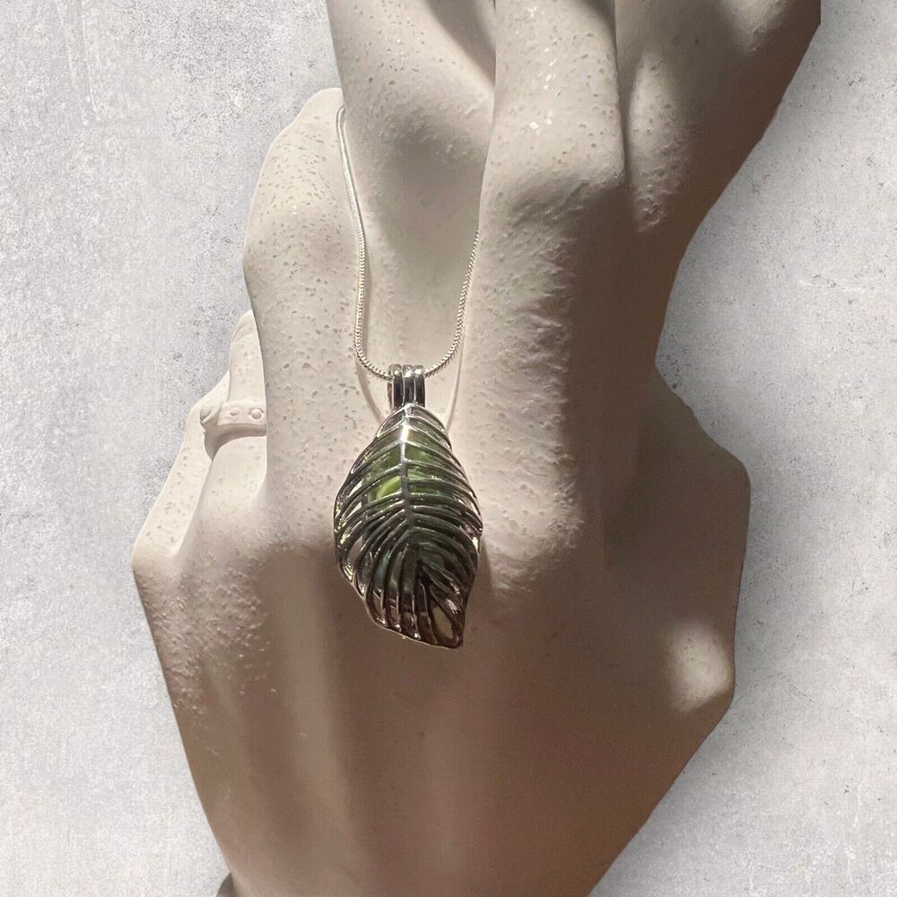 Silver Leaf Shaped Pearl Cage Pendant Necklace with a green and blue Pearl
